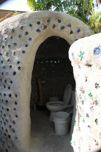 Recycled trash turned into a classy composting outhouse at Communitiere